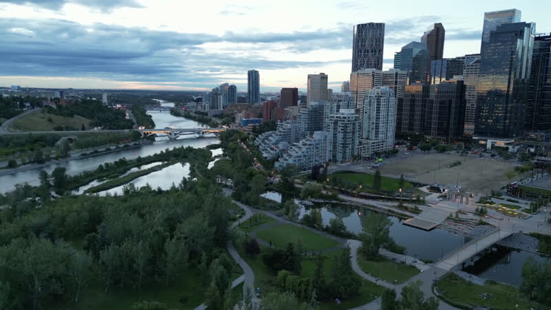 The Bow River and downtown Calgary seen from above at dusk.